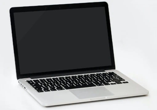 Computador portátil cor de alumínio teclado preto.